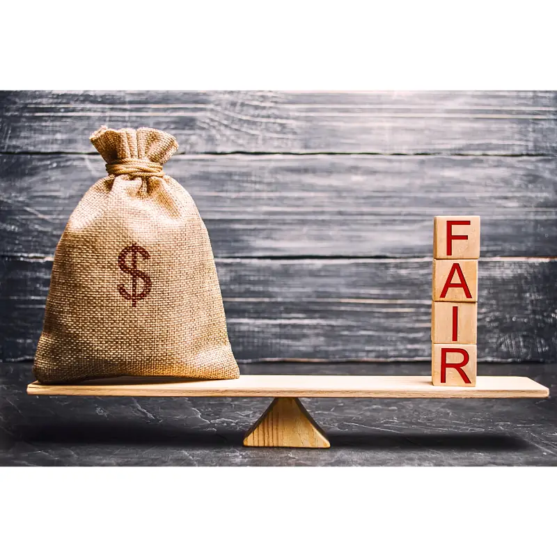 access-model-fair-compensation-blockchain-data Balanced scale with a money sack on one side and wooden blocks spelling “FAIR” on the other, symbolizing equitable compensation for farm data in blockchain systems.