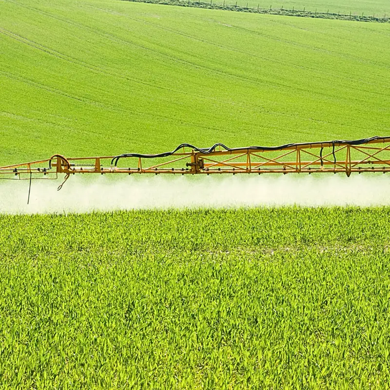 sprayer-equipment-blockchain-opportunity Modern agricultural sprayer operating in a field, representing data-driven crop management and blockchain opportunities for equipment manufacturers